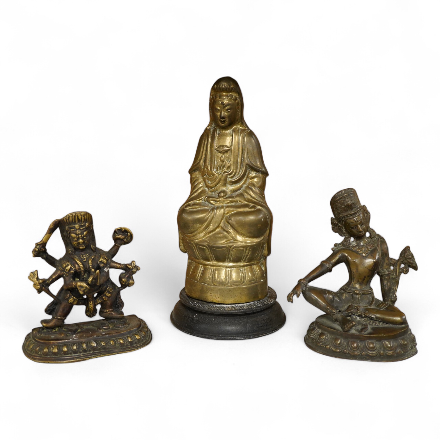 Three South East Asian brass figures to include one of Bodhisattva, largest 28cm high